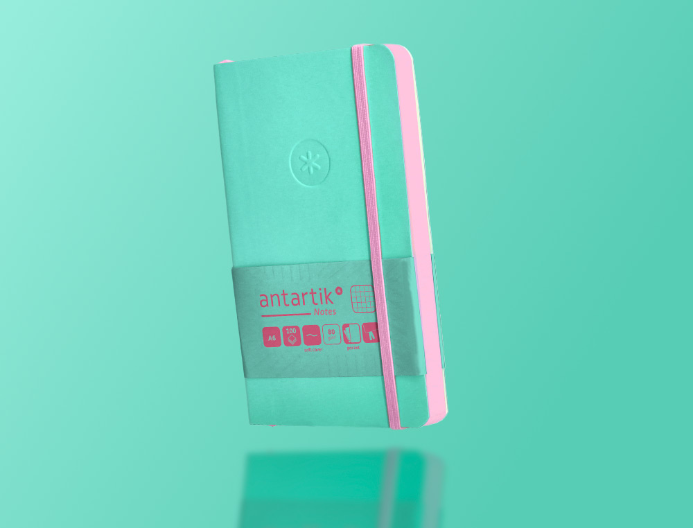 CUADERNO CON GOMILLA ANTARTIK NOTES TAPA BLANDA A6 CUADRICULA ROSA Y TURQUESA 100 HOJAS 80 GR FSC